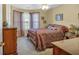 Inviting bedroom showcasing a well-made bed, a window for natural light, and classic wooden furniture at 251 Bent Creek Dr, Dallas, GA 30157