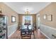 Formal dining room with classic wainscoting, a modern chandelier, and plenty of space at 251 Bent Creek Dr, Dallas, GA 30157