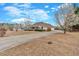 Expansive home featuring a long driveway and well-manicured front yard at 251 Bent Creek Dr, Dallas, GA 30157