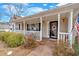 Inviting front porch with white railings, decorative plants, and a welcoming entrance at 251 Bent Creek Dr, Dallas, GA 30157
