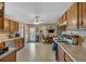 Well-equipped kitchen with oak cabinets, modern appliances, and an open layout to dining area at 251 Bent Creek Dr, Dallas, GA 30157