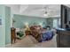 Serene main bedroom with a trey ceiling, ceiling fan, a comfortable bed, and a cozy sitting area with natural light at 251 Bent Creek Dr, Dallas, GA 30157