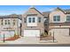 Brick townhouse with two-car garage and well-manicured landscaping at 2855 Mcmurtry St, Cumming, GA 30041