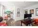 Spacious game room with hardwood flooring, natural light, and unique artwork at 2855 Mcmurtry St, Cumming, GA 30041