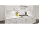 Bright kitchen featuring stainless appliances, white subway tile backsplash, and light countertops at 2855 Mcmurtry St, Cumming, GA 30041