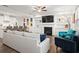 Open concept living space with fireplace, built-ins, and seamless flow into kitchen at 2855 Mcmurtry St, Cumming, GA 30041