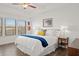 Bright main bedroom with tray ceiling, large windows, and stylish furnishings at 2855 Mcmurtry St, Cumming, GA 30041