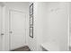 Mud room area featuring a bench, artwork, and a door with clean, white trim at 2855 Mcmurtry St, Cumming, GA 30041