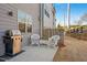 Cozy patio space with grill and white wicker furniture, perfect for outdoor entertaining at 2855 Mcmurtry St, Cumming, GA 30041