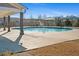 Community swimming pool with covered seating areas and well-maintained grounds at 2855 Mcmurtry St, Cumming, GA 30041