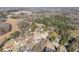An aerial view of homes nestled among the trees, showcasing the peaceful residential landscape at 6920 Greenfield Ln, Cumming, GA 30028