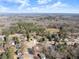 Aerial view of homes surrounded by a beautiful forest, showcasing the serene residential landscape at 6920 Greenfield Ln, Cumming, GA 30028