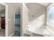 Bathroom with a jacuzzi tub perfect for relaxation and a calm ambience at 6920 Greenfield Ln, Cumming, GA 30028