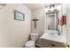 Quaint powder room with unique wall decor and a decorative mirror enhances the space at 6920 Greenfield Ln, Cumming, GA 30028