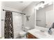 Neutral bathroom features a shower and tub combination and a single sink vanity at 6920 Greenfield Ln, Cumming, GA 30028