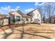 Beautiful backyard with a covered patio and lush landscaping at 6920 Greenfield Ln, Cumming, GA 30028