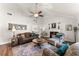 Spacious living room featuring vaulted ceilings, a cozy fireplace, and comfortable seating at 6920 Greenfield Ln, Cumming, GA 30028