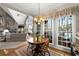 Cozy breakfast area with natural light and view of the Gathering room with fireplace at 3202 Eagle Watch Dr, Woodstock, GA 30189