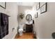 Stylish powder room with hardwood floors, modern fixtures, and decorative accents at 3202 Eagle Watch Dr, Woodstock, GA 30189