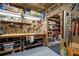 Well-organized workshop featuring a workbench, pegboard, and shelving providing ample room for projects at 3202 Eagle Watch Dr, Woodstock, GA 30189