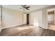 Bedroom featuring wood-look flooring, closet, and an adjacent bathroom with shower/tub combo at 840 Wells Se Cir, Smyrna, GA 30080