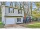 Charming split-level home with gray siding, black shutters, and an attached single-car garage at 840 Wells Se Cir, Smyrna, GA 30080