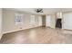 Bright living room featuring sleek wood floors, neutral paint, and a modern ceiling fan at 840 Wells Se Cir, Smyrna, GA 30080
