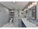 Elegant bathroom with marble floors, featuring a glass enclosed shower and stylish fixtures at 311 Maranatha Trl, Lawrenceville, GA 30045