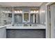 Modern bathroom with dual sinks, vanity mirrors, and luxurious glass shower at 311 Maranatha Trl, Lawrenceville, GA 30045