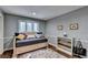 Cozy bedroom featuring a comfortable daybed and stylish decor at 311 Maranatha Trl, Lawrenceville, GA 30045