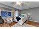 Comfortable bedroom featuring hardwood floors and stylish decor at 311 Maranatha Trl, Lawrenceville, GA 30045
