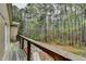 Relaxing outdoor deck with wooded views, perfect for enjoying nature at 311 Maranatha Trl, Lawrenceville, GA 30045