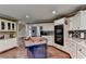 Well-equipped kitchen with a center island, custom backsplash, and stainless steel appliances at 311 Maranatha Trl, Lawrenceville, GA 30045