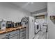 Practical laundry room with a washer, dryer, modern appliances and stylish countertops at 311 Maranatha Trl, Lawrenceville, GA 30045