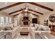 Comfortable living area with stone fireplace, wood beams and access to outdoor views at 311 Maranatha Trl, Lawrenceville, GA 30045