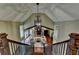 Grand living room with vaulted ceilings, a stone fireplace, and a view from the second story at 311 Maranatha Trl, Lawrenceville, GA 30045