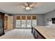 Spacious main bedroom features multiple windows for great light and a ceiling fan at 311 Maranatha Trl, Lawrenceville, GA 30045