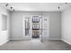 Charming living area with double doors to the balcony with views of a courtyard swimming pool at 5300 Peachtree Rd # 2309, Chamblee, GA 30341