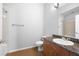 Bathroom featuring granite counters, wood cabinets, tile flooring and shower over tub at 5300 Peachtree Rd # 2309, Chamblee, GA 30341