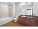 Bathroom featuring vanity with granite counters, white toilet, and shower with beige tiles at 5300 Peachtree Rd # 2309, Chamblee, GA 30341