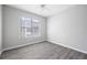 Bright bedroom with a ceiling fan and window showing the view outside at 5300 Peachtree Rd # 2309, Chamblee, GA 30341