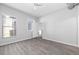 Bright bedroom featuring hardwood flooring, a ceiling fan and large window with plenty of natural light at 5300 Peachtree Rd # 2309, Chamblee, GA 30341