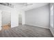 Spacious bedroom features wood-look flooring, a ceiling fan and ensuite bathroom with a walk-in closet at 5300 Peachtree Rd # 2309, Chamblee, GA 30341