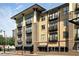 Modern apartment complex showcasing multiple levels, brick accents, and balconies on a sunny day at 5300 Peachtree Rd # 2309, Chamblee, GA 30341