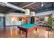 Modern common room with a pool table, seating, and kitchen/bar area at 5300 Peachtree Rd # 2309, Chamblee, GA 30341