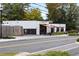 Exterior view of Hopstix, a restaurant with outdoor seating and modern architecture in the daytime at 5300 Peachtree Rd # 2309, Chamblee, GA 30341