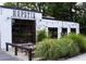 Exterior view of Hopstix Robata Grill, Raw Bar, Brewery with outdoor seating and signage at 5300 Peachtree Rd # 2309, Chamblee, GA 30341