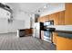 Kitchen features wood cabinets, granite countertops, stainless steel appliances and wood-look floors at 5300 Peachtree Rd # 2309, Chamblee, GA 30341