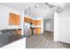 Bright kitchen boasts stainless steel appliances, wooden cabinets and granite countertops and wood-look floors at 5300 Peachtree Rd # 2309, Chamblee, GA 30341