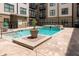 Community pool features a tanning ledge, small waterfall feature, and courtyard views at 5300 Peachtree Rd # 2309, Chamblee, GA 30341